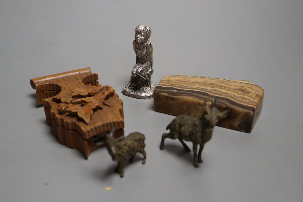 A carved boxwood watch stand, two cold painted bronze goats, an agate paperweight and a cast seated youth, watch stand 10cm